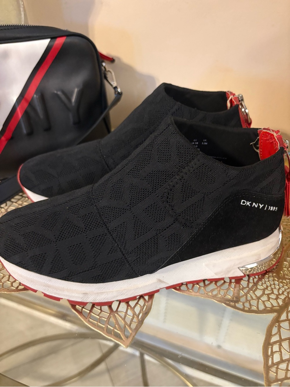 DKNY Black Knit Slip-On Sneakers with Red Accents
